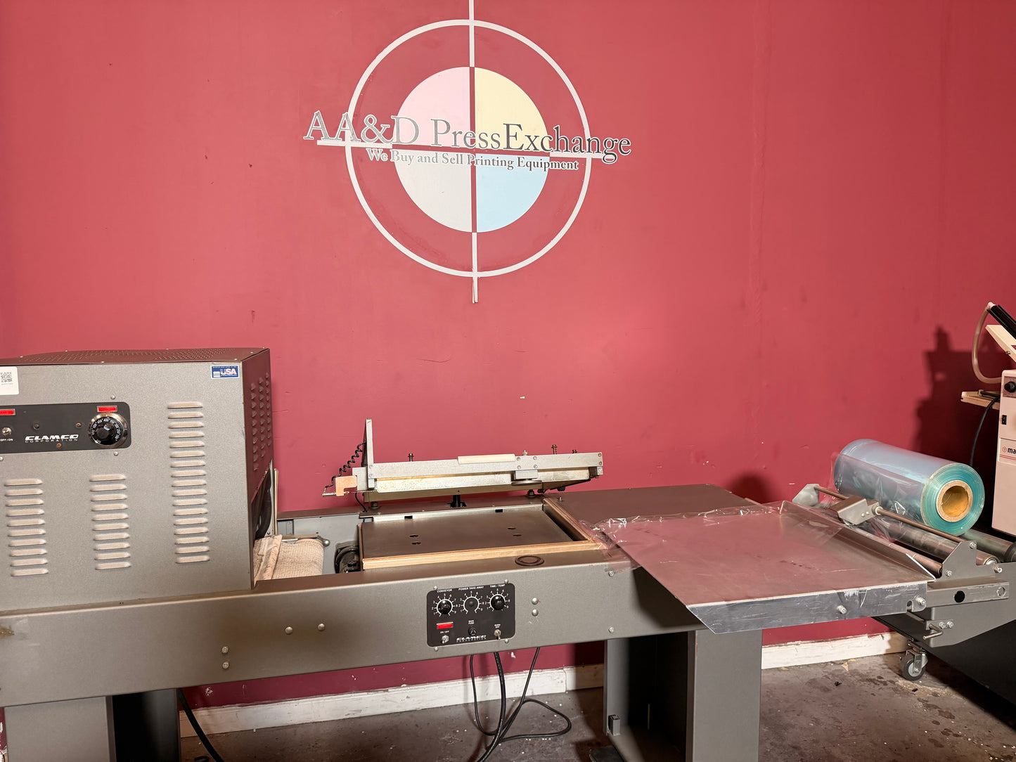 Used Clamco L bar sealer with integrated heat shrink tunnel side view