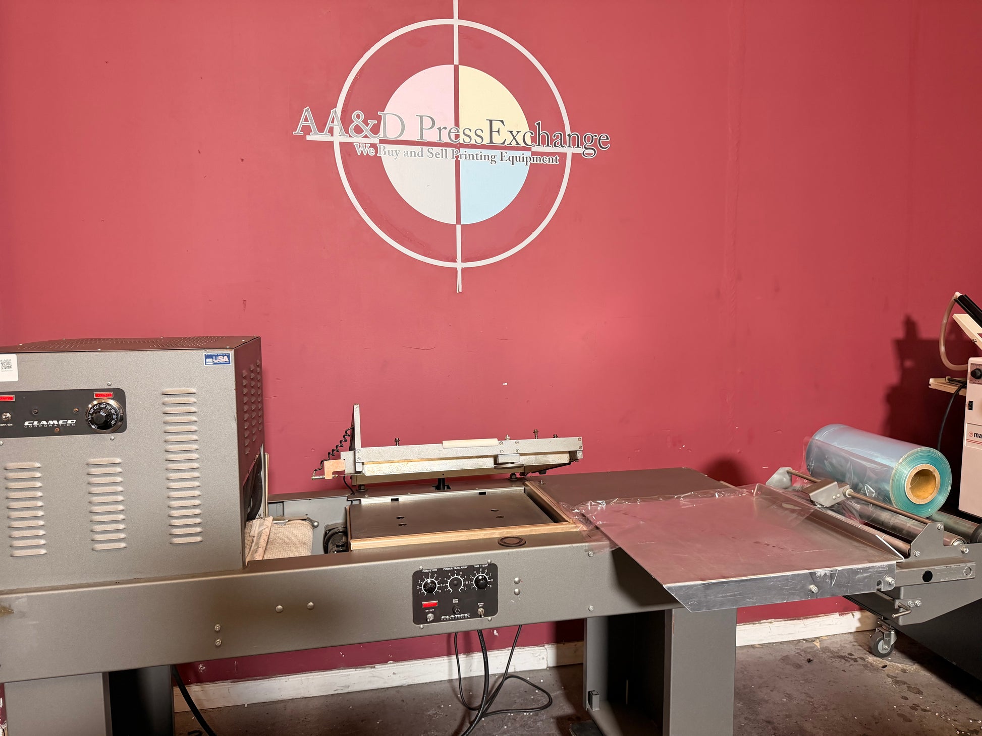 Used Clamco L bar sealer with integrated heat shrink tunnel side view