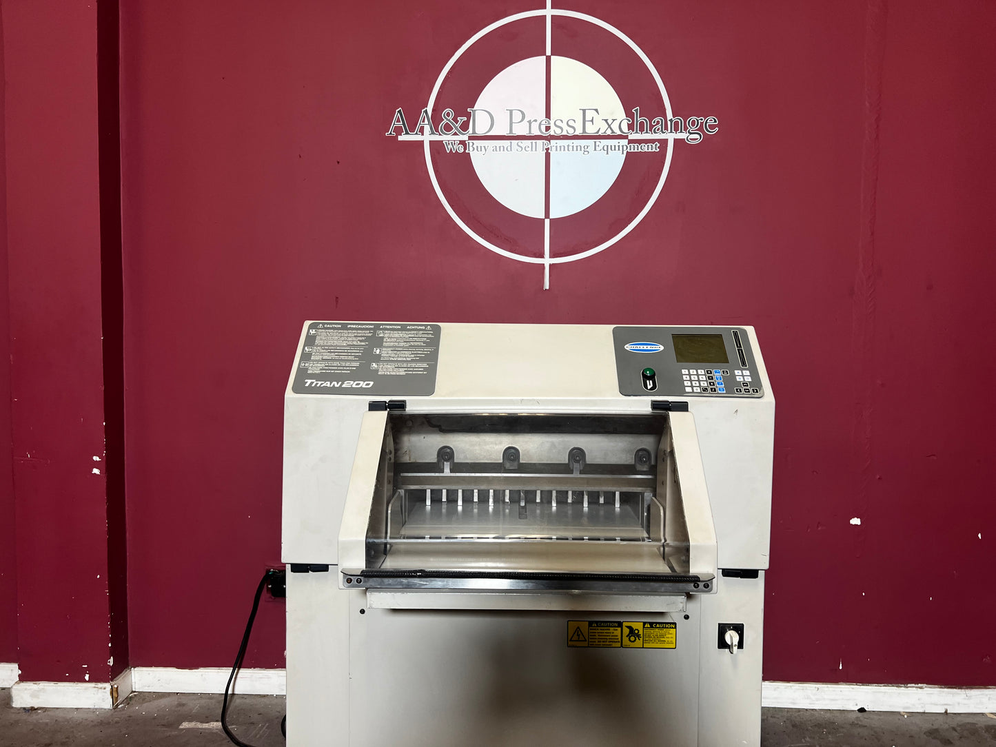 Side view of AA&D PressExchange used Challenge Titan 200 Hydraulic Paper Cutter.