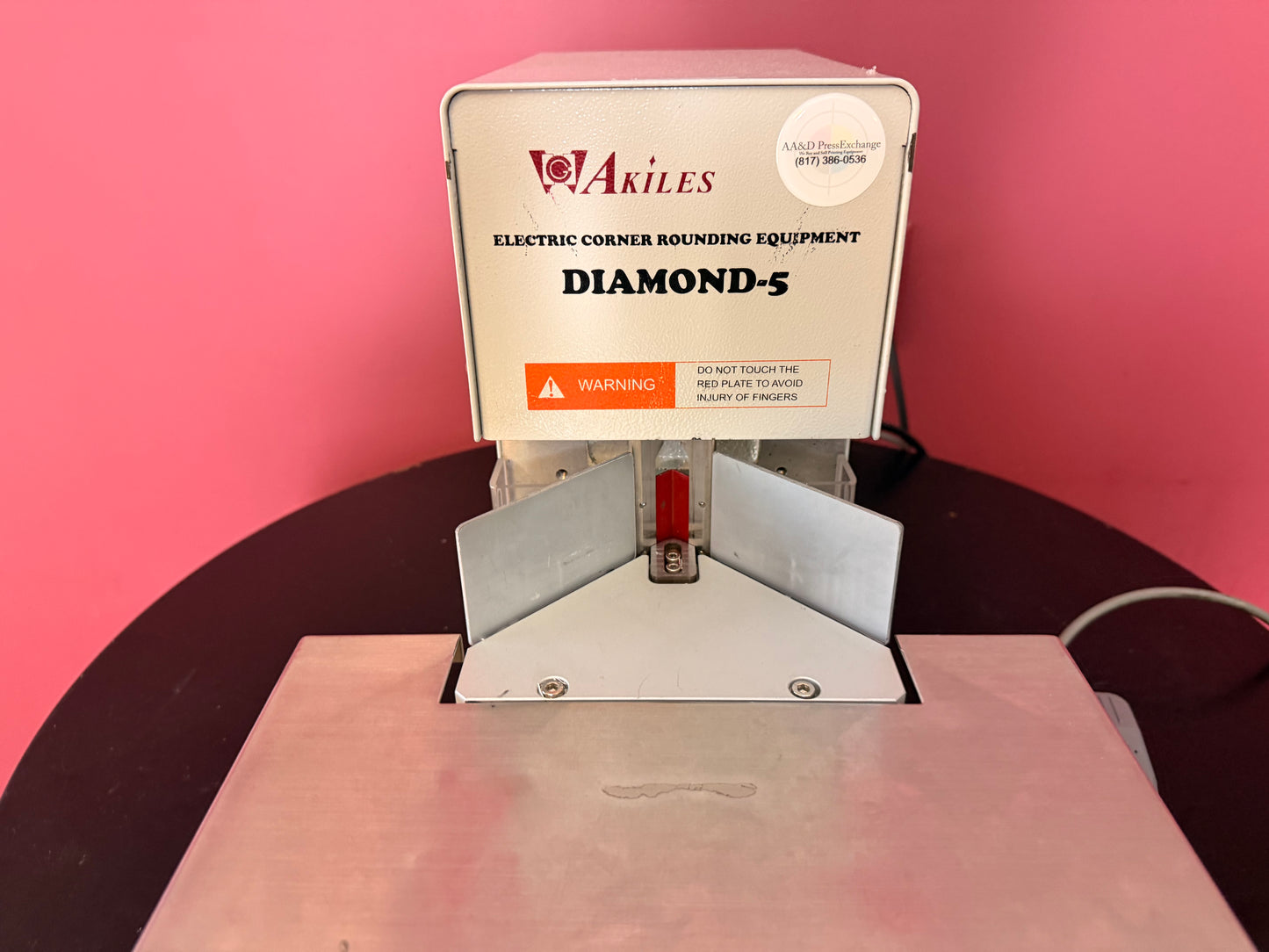 Used Akiles Diamond-5 electric corner rounding machine with sturdy base and motor housing – AA&D PressExchange