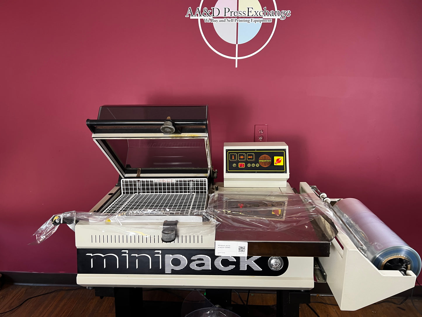 Used Minipack FM-75 Digit semi-automatic shrink wrap machine front view | AA&D PressExchange