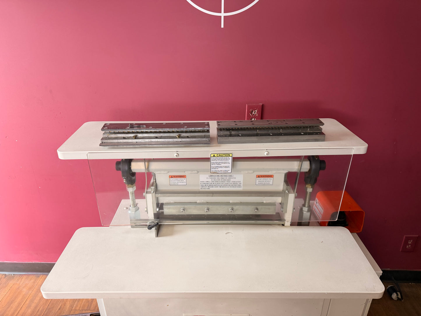 Side angle of used GBC Sickinger MHP 17 highlighting sturdy metal frame and 3-phase motor