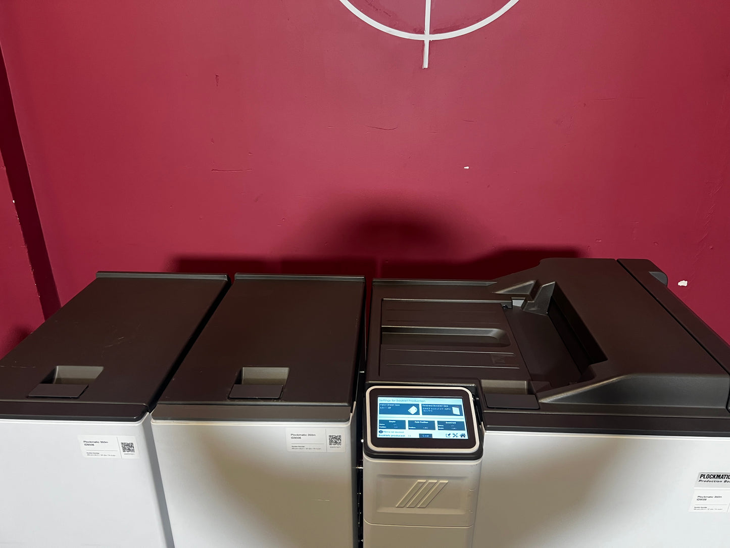 Used Plockmatic 350-M booklet maker 28k meter angled view highlighting saddle-stitch unit – AA&D PressExchange