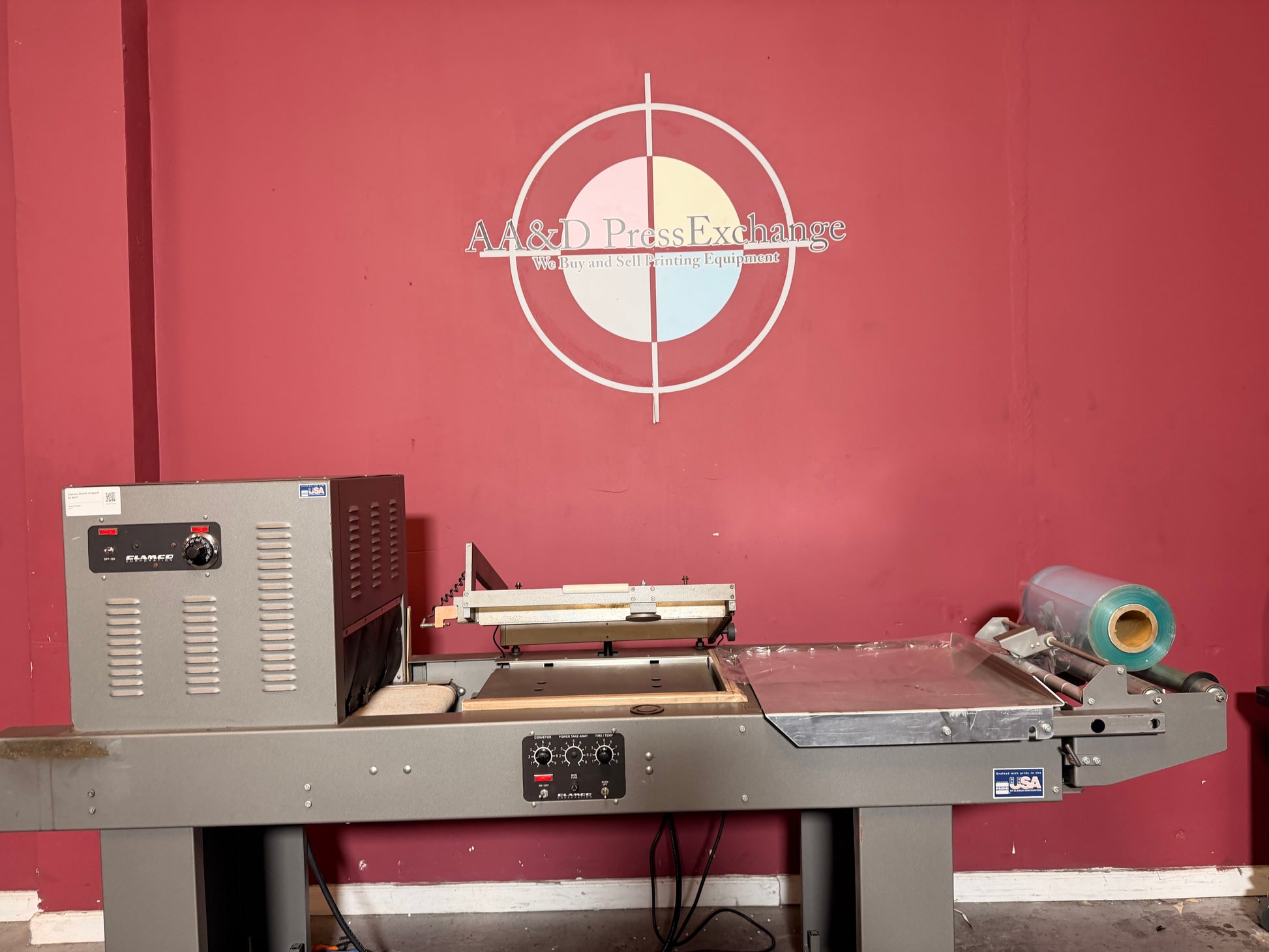 Used Clamco shrink wrapper with power take away conveyor packaging line detail