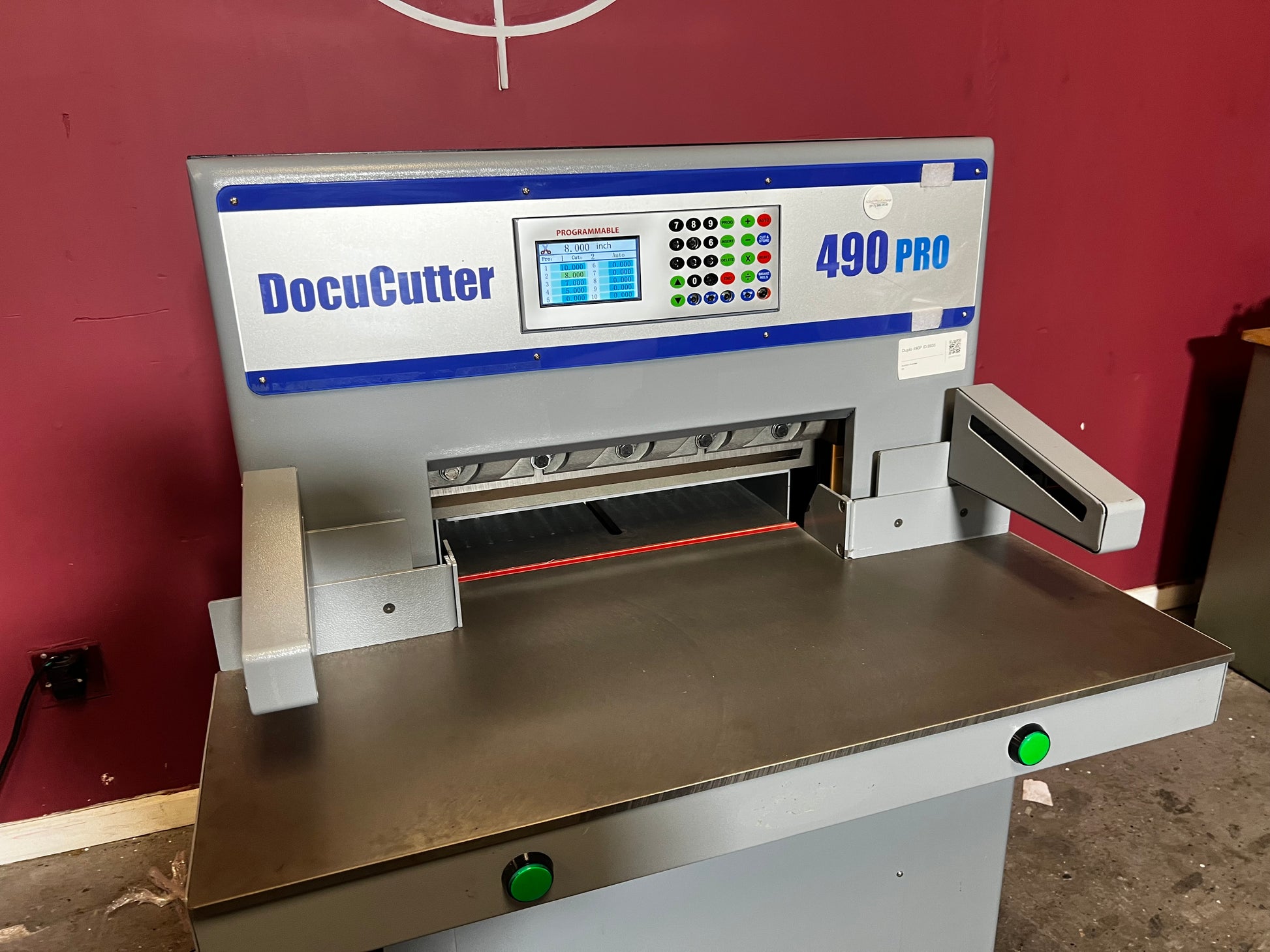 AA&D PressExchange Used Duplo 490 PRO hydraulic paper cutter angled view showing overall machine build