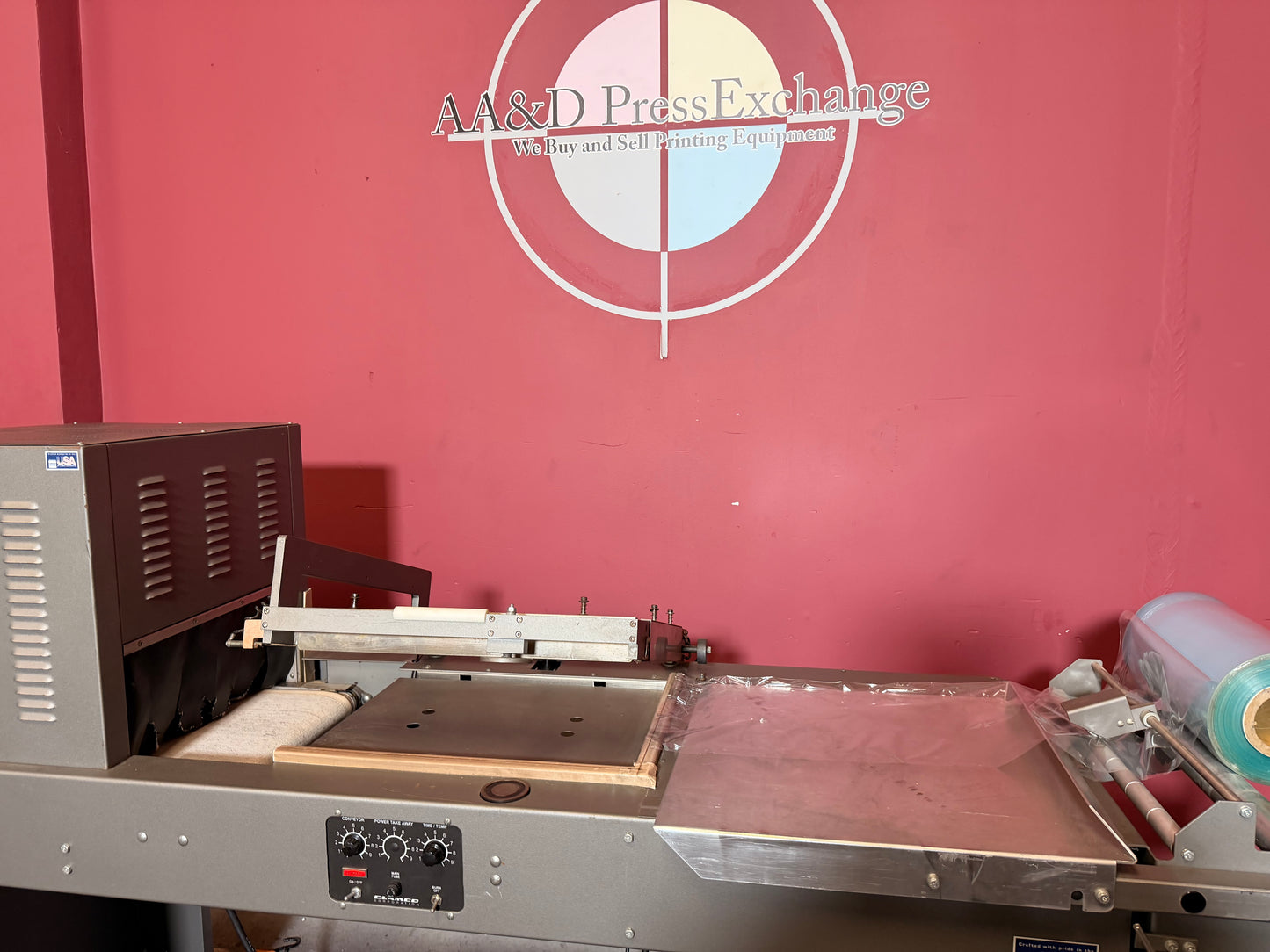 Used industrial Clamco L bar heat tunnel combo automatic shrink wrapping machine