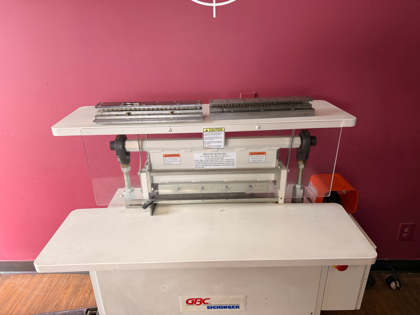 Close-up of used GBC Sickinger MHP 17 electric motor and control panel with power switch