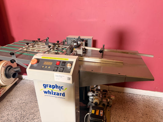 Used Graphic Whizard UPG450PF pile feeder showing the front control panel, feed table, sheet guides, and rollers.