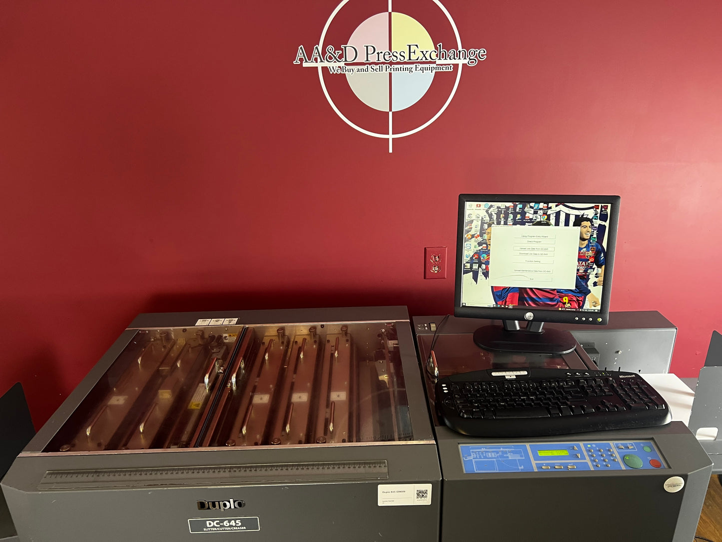 Used Duplo DC-645 automatic slitter cutter creaser angled view – AA&D PressExchange