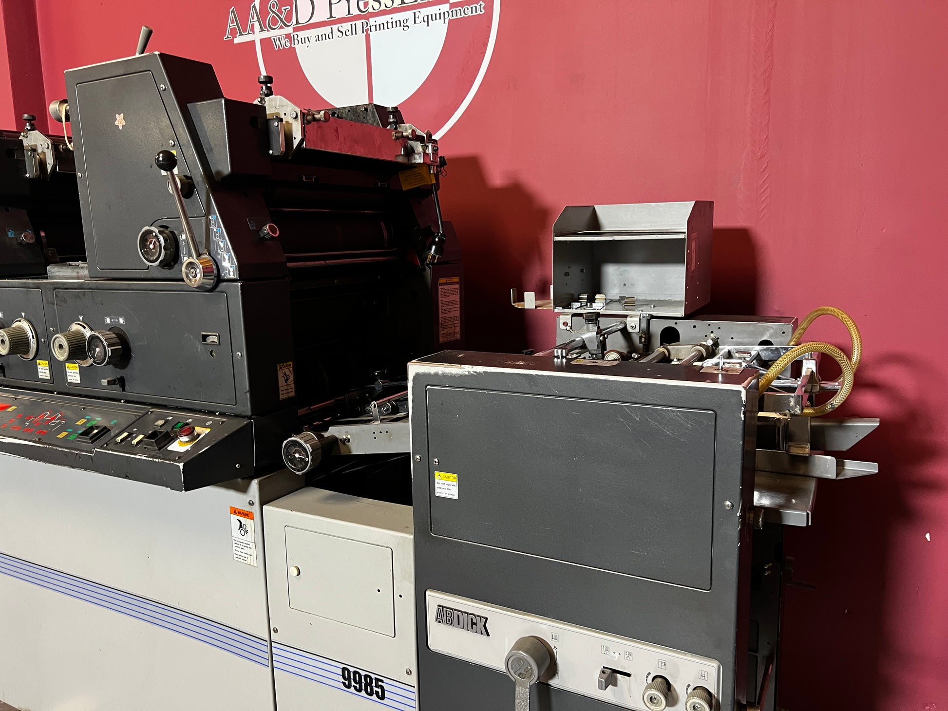 Used AB Dick 9985 True Two-Color printing press in production setup – AA&D PressExchange