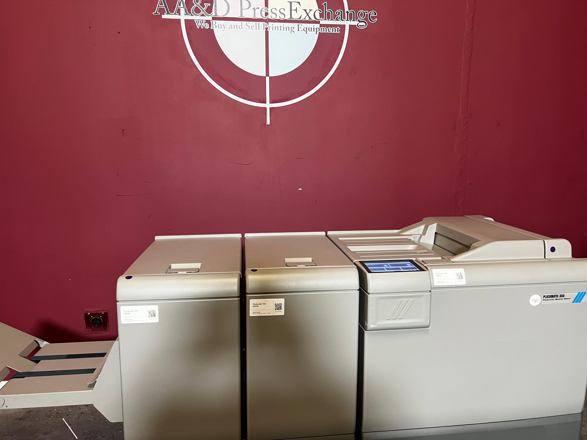 Used Plockmatic 350 90k booklet maker side/angled view highlighting saddle-stitch unit – AA&D PressExchange