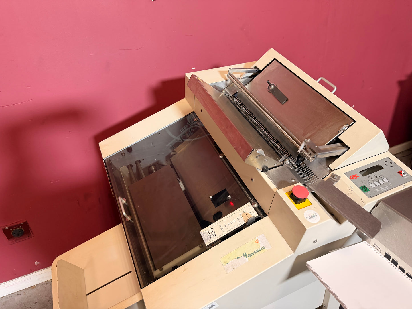 Used GBC DigiCoil machine close-up of coil cutting and crimping section – AA&D PressExchange