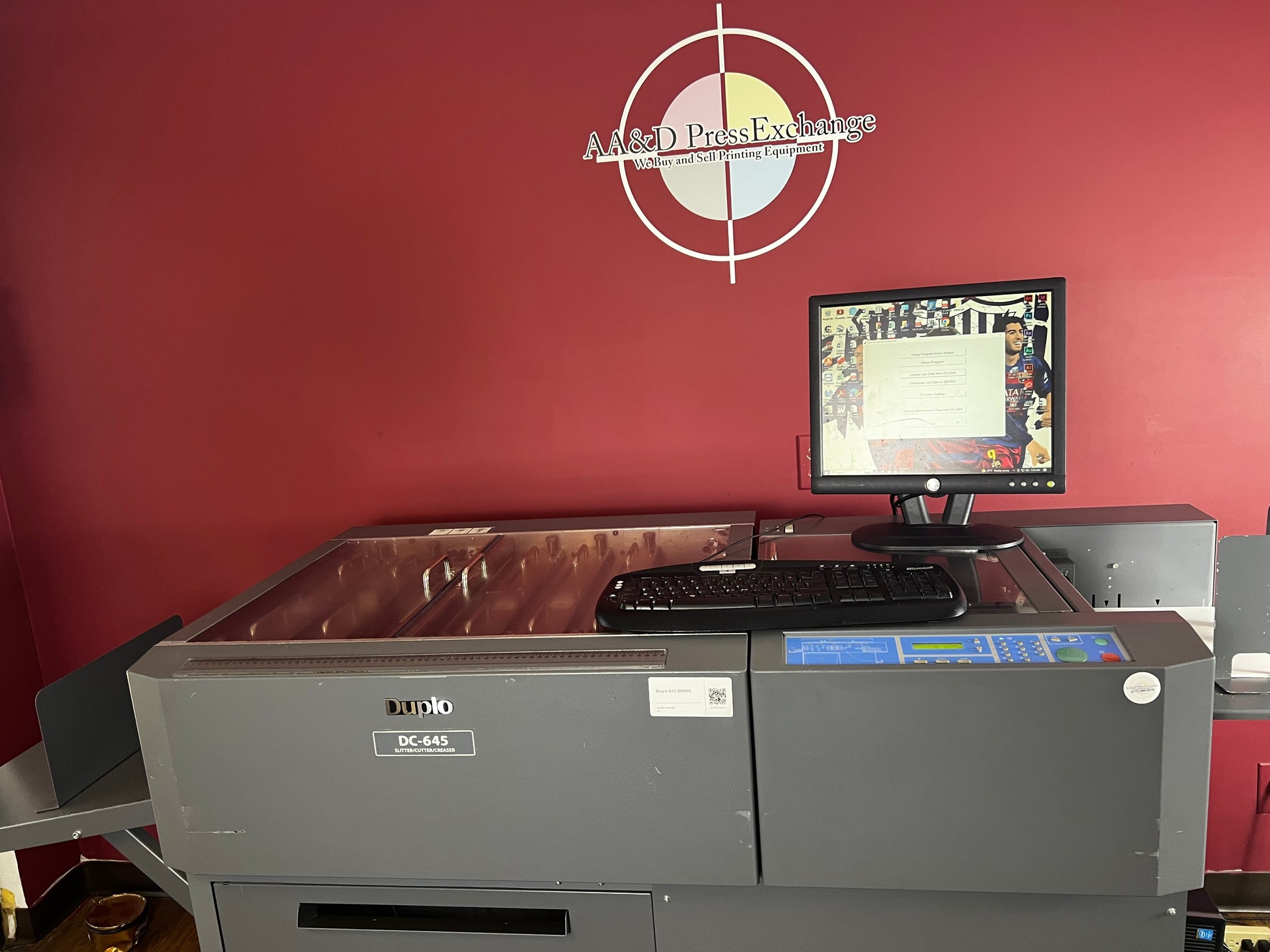 Used Duplo DC-645 Slitter Cutter Creaser close-up of feeding section – AA&D PressExchange