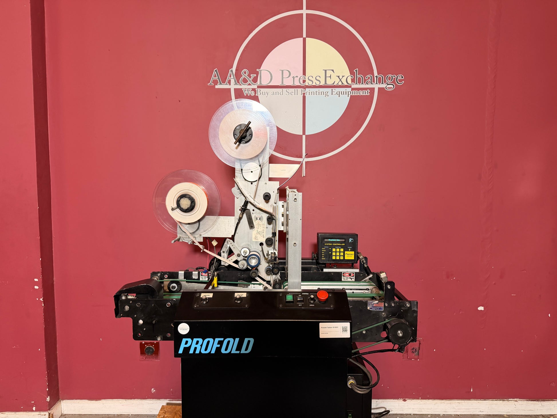 Used Profold tabbing machine tab placement rollers and mechanism for precise tab alignment