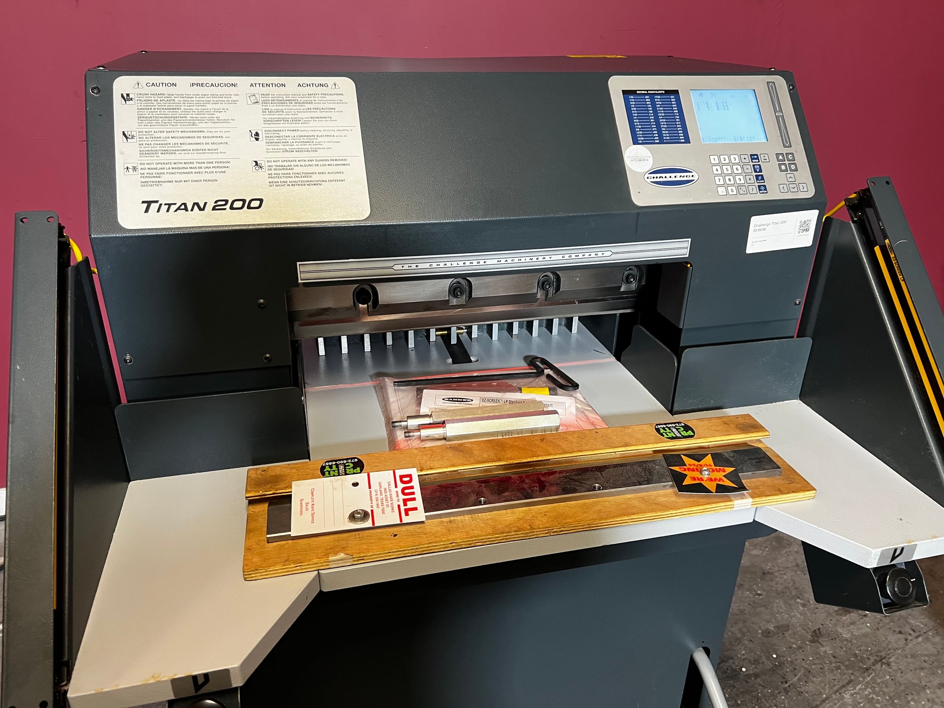 Used Challenge Titan 200C hydraulic paper cutter close-up of touchscreen and control panel – AA&D PressExchange