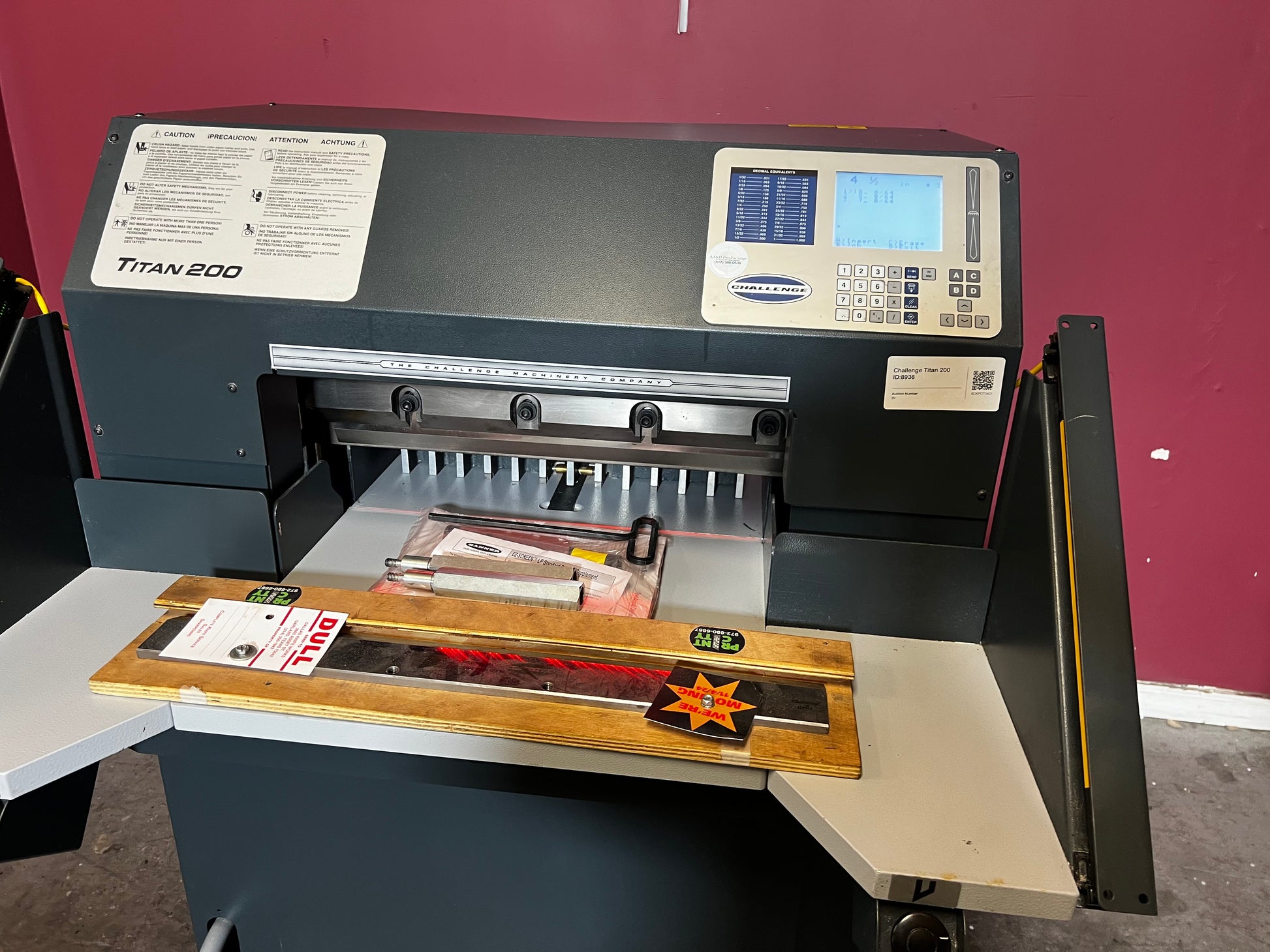 Used Challenge Titan 200C hydraulic paper cutter side view highlighting hydraulic system – AA&D PressExchange