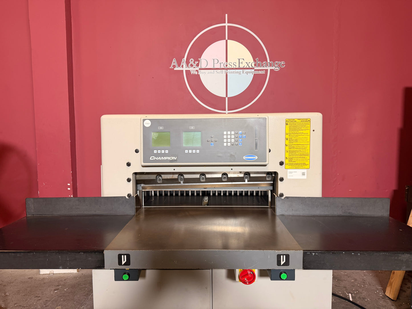 Used Challenge 305 XG heavy-duty hydraulic clamp close-up high pressure system for precise paper stack cutting operations