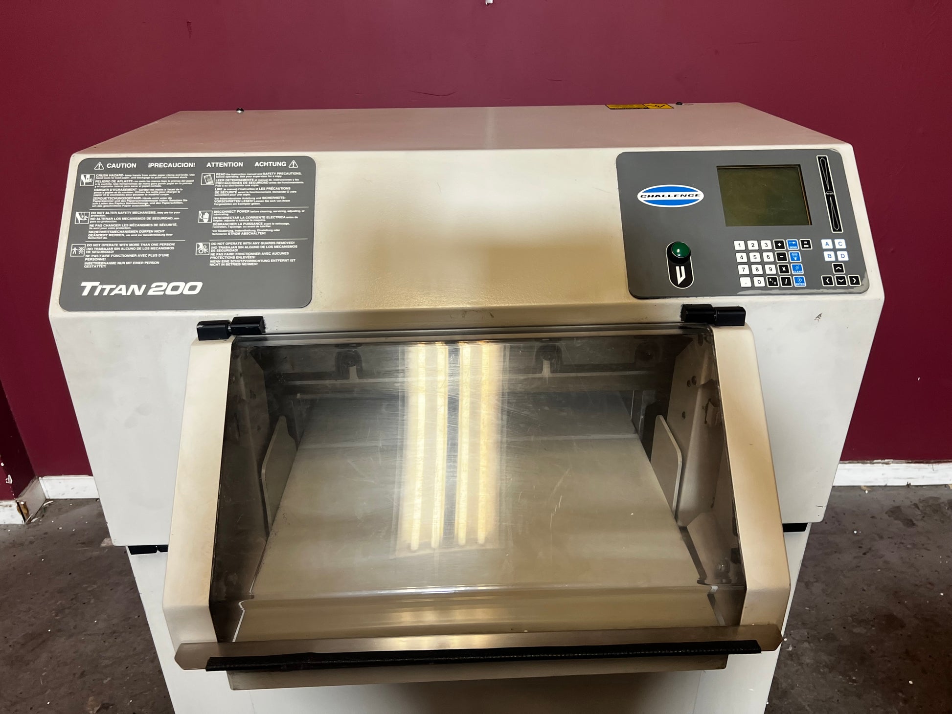 Used Challenge Titan 200 Hydraulic Paper Cutter showing LED cut line, AA&D PressExchange.