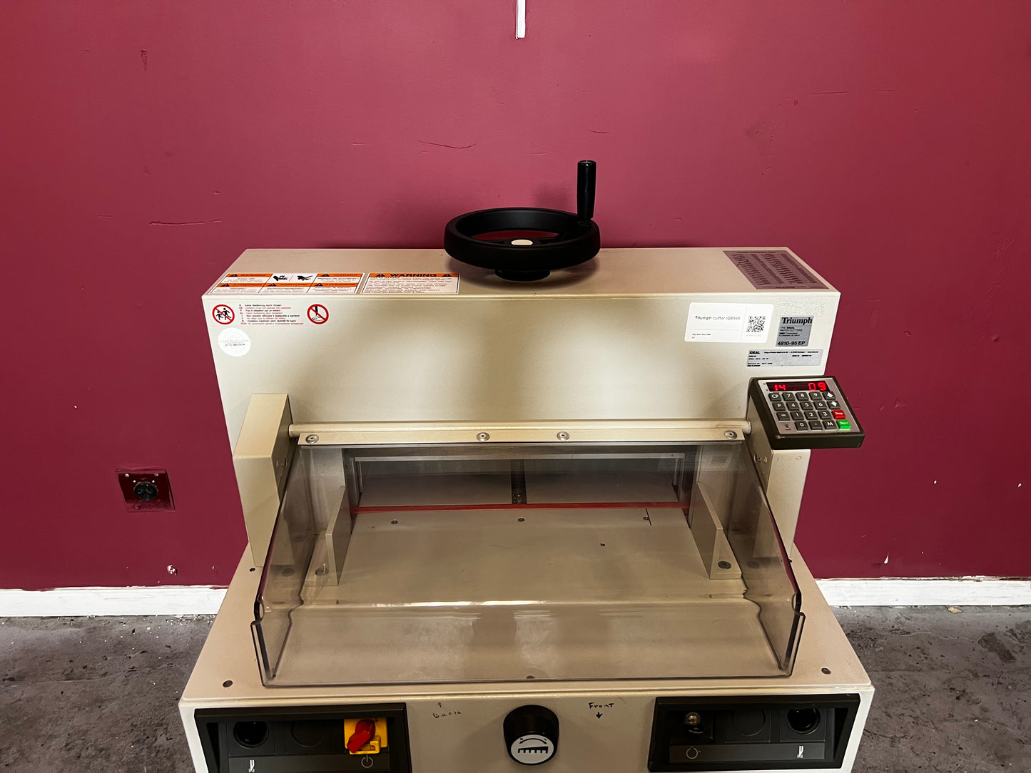 Used Triumph 4810-95EP guillotine cutter angled view in production setup – AA&D PressExchange
