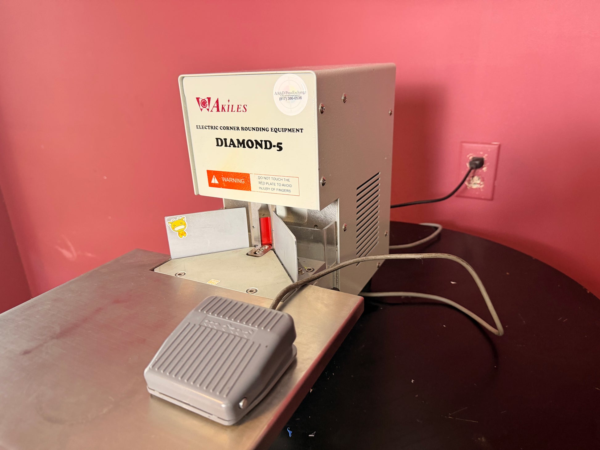 Used Akiles Diamond-5 corner rounder showing push-down lever and cutting area – AA&D PressExchang
