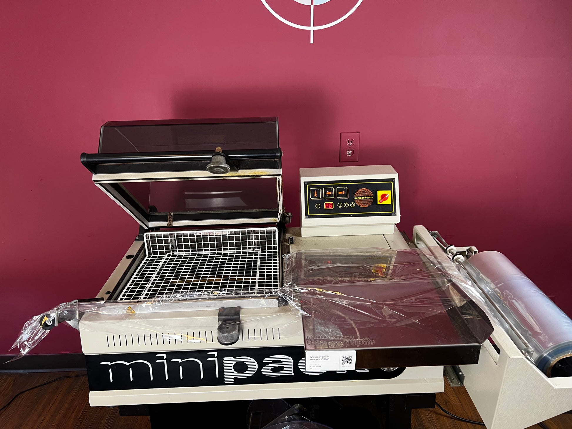 Used Minipack FM-75 Digit shrink wrap machine side profile | AA&D PressExchange