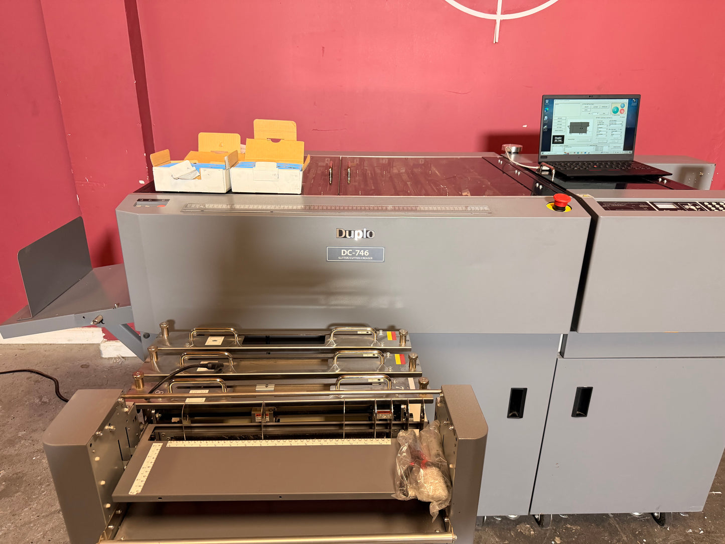 Used Duplo DC-746 Slitter Cutter Creaser side view showing full system layout