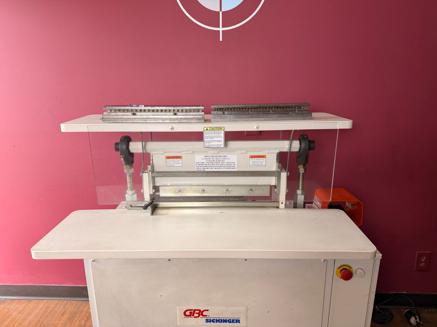 Used side view of GBC Sickinger MHP 17 industrial paper punch highlighting foot pedal operation