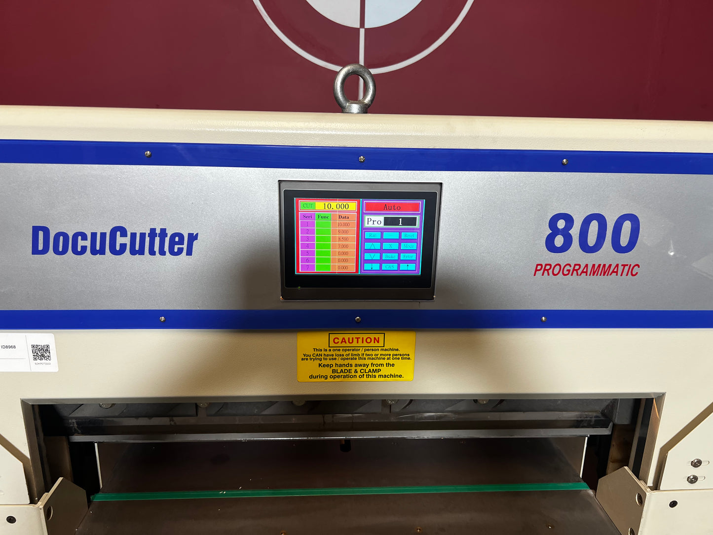 Used Duplo Docucutter 800 Programmatic rear angle showing hydraulic cutting mechanism – AA&D PressExchange