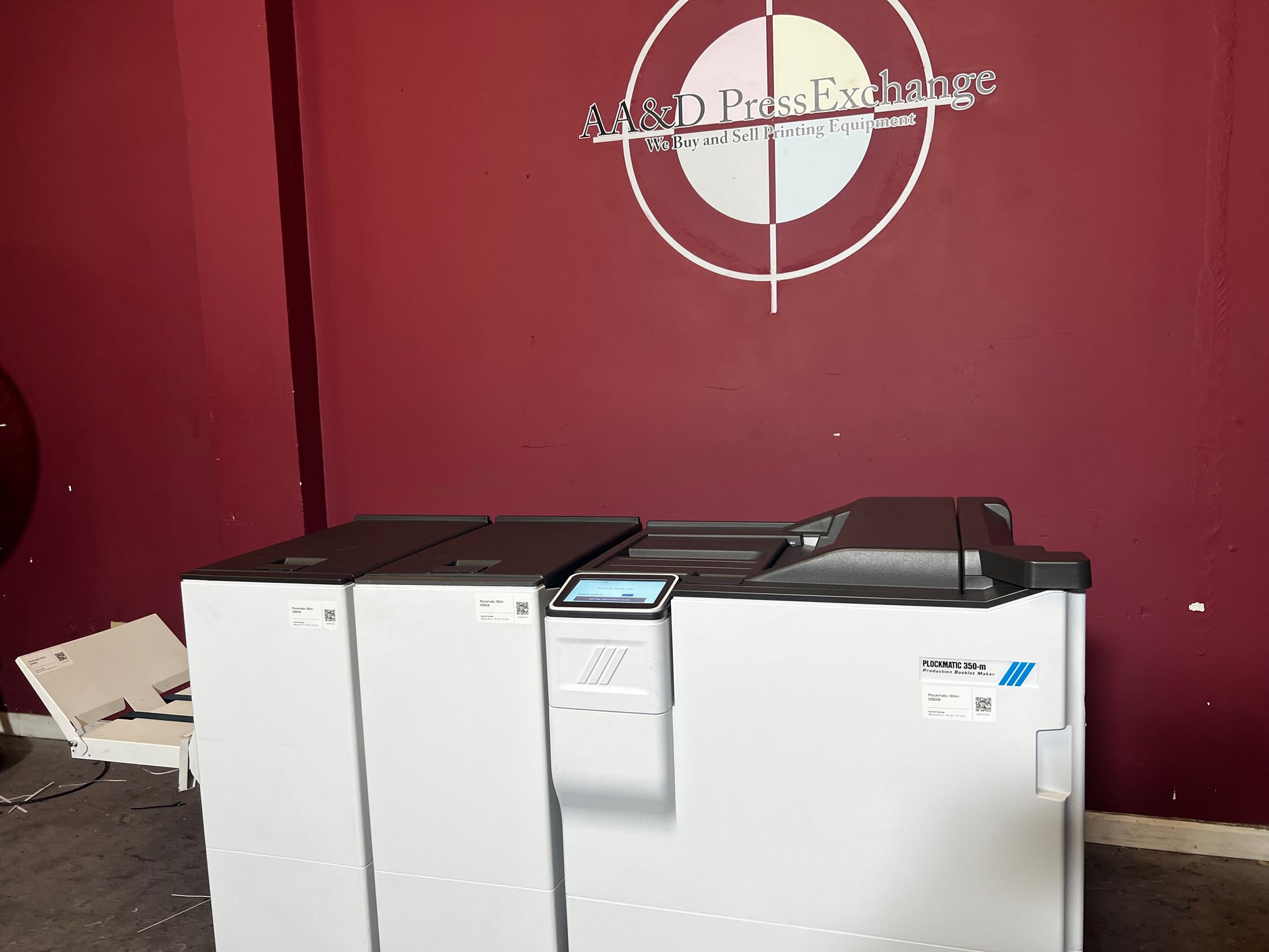 Used Plockmatic 350-M booklet maker 28k meter rear/side view highlighting booklet output tray – AA&D PressExchange