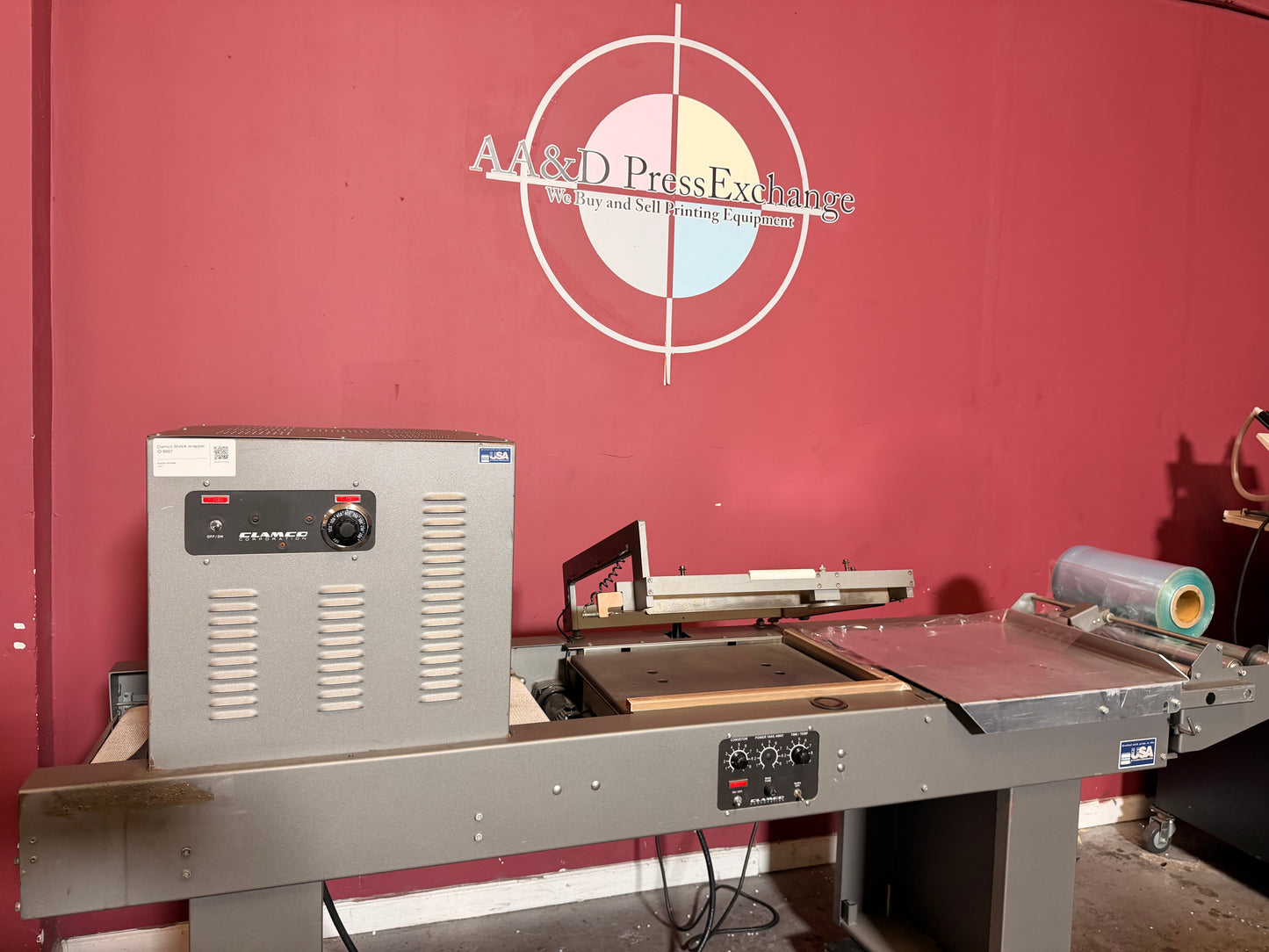 Used integrated Clamco shrink wrapper heat tunnel combo for books toys and food