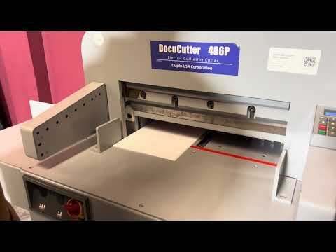 Used Duplo DocuCutter 486P electric paper cutter overview in professional finishing environment – AA&D PressExchange